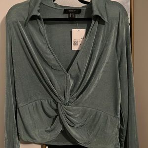 Green twist front crop top.